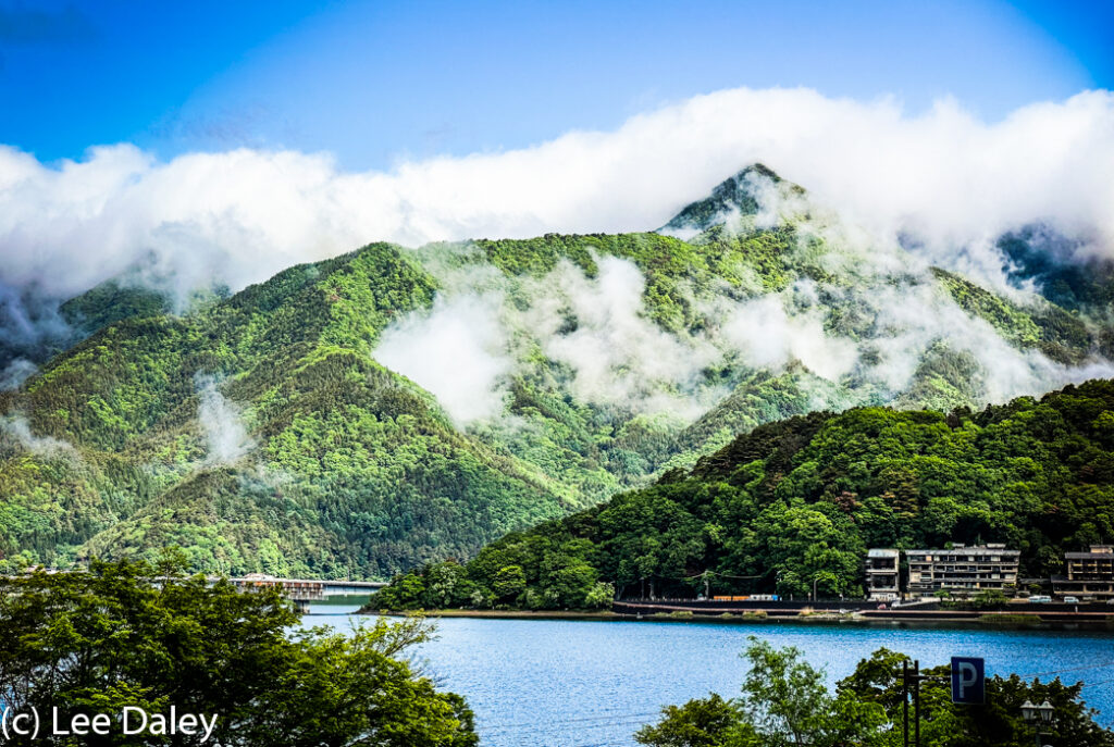 Japan,Lake Kawaguchico, Mount Fuji through the clouds