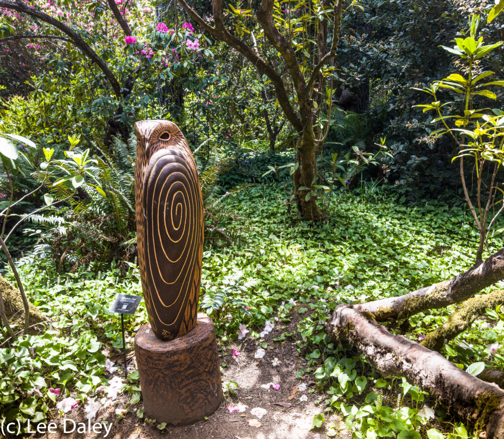 "Wisdom Owl" greets visitors as they walk to the ocean that borders the gardens.